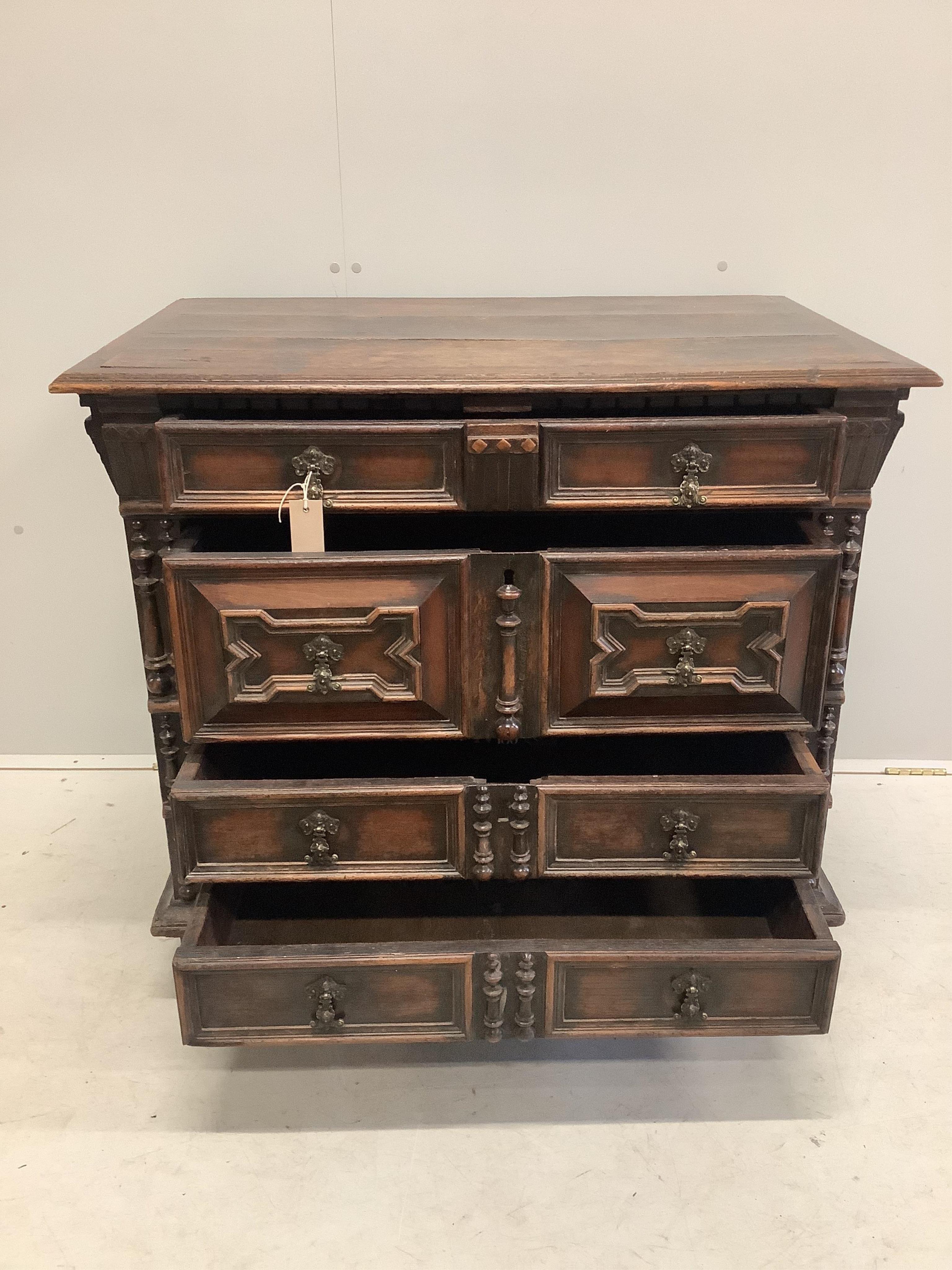 An 18th century oak block front chest of drawers, width 96cm, depth 61cm, height 85cm. Condition - fair to good